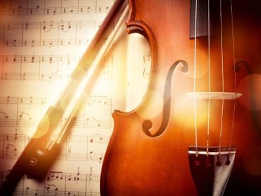Close-up Photo Of Violin And Musical Notes